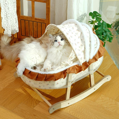 couffin pour chat baskul chat regarde dehors