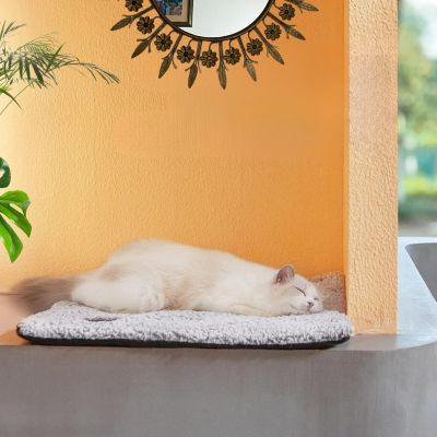 tapis-chat-félin-qui-dort-sur-tapis-chauffant